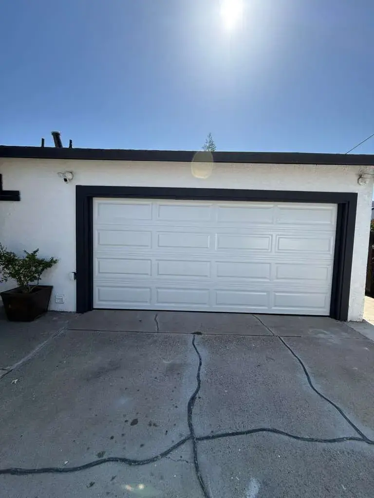 15x7 White Long Panel Garage Door Installation for a Clean Residential Upgrade — Standard residential installation, panel and hardware setup, track alignment, spring balance, final operation testing.