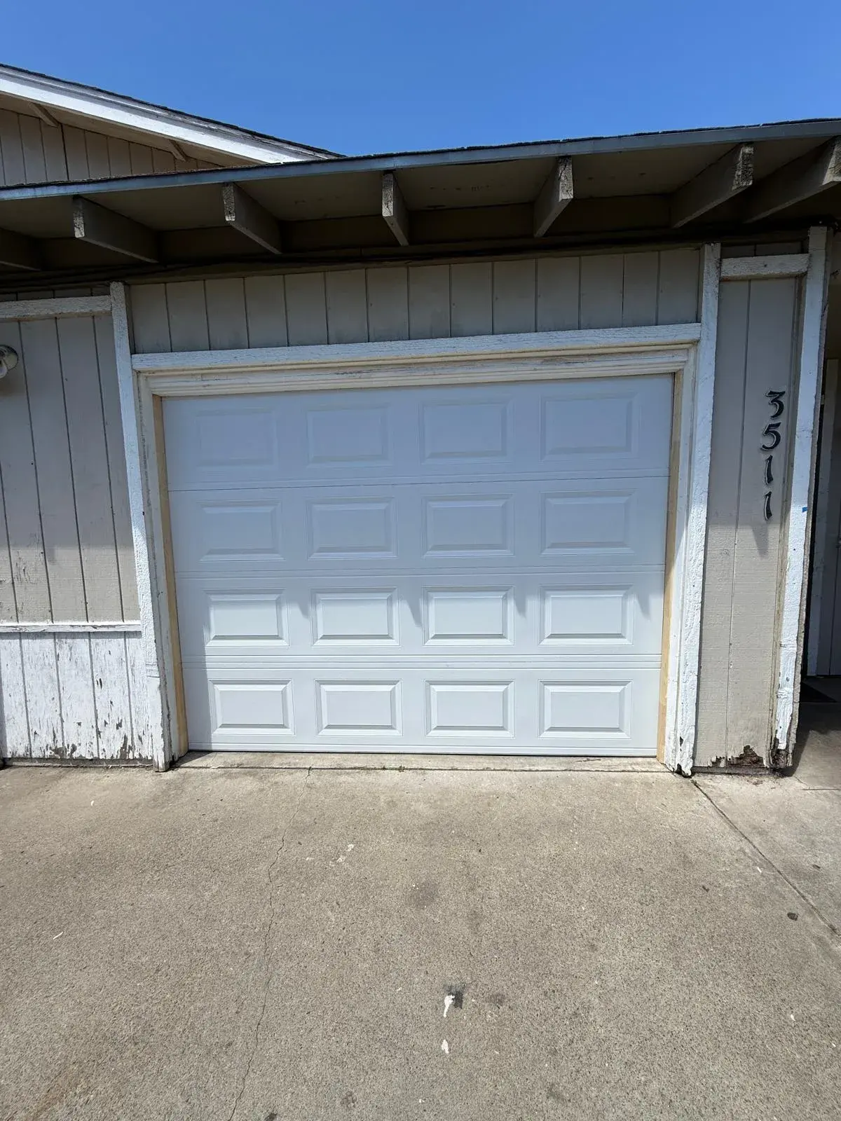 Before and After: 9x7 C.H.I. Model 2250 White Garage Door Replacement — : old door removal, new sectional door installation, hardware replacement, spring balance, safety check. Product: 9' x 7' whi —