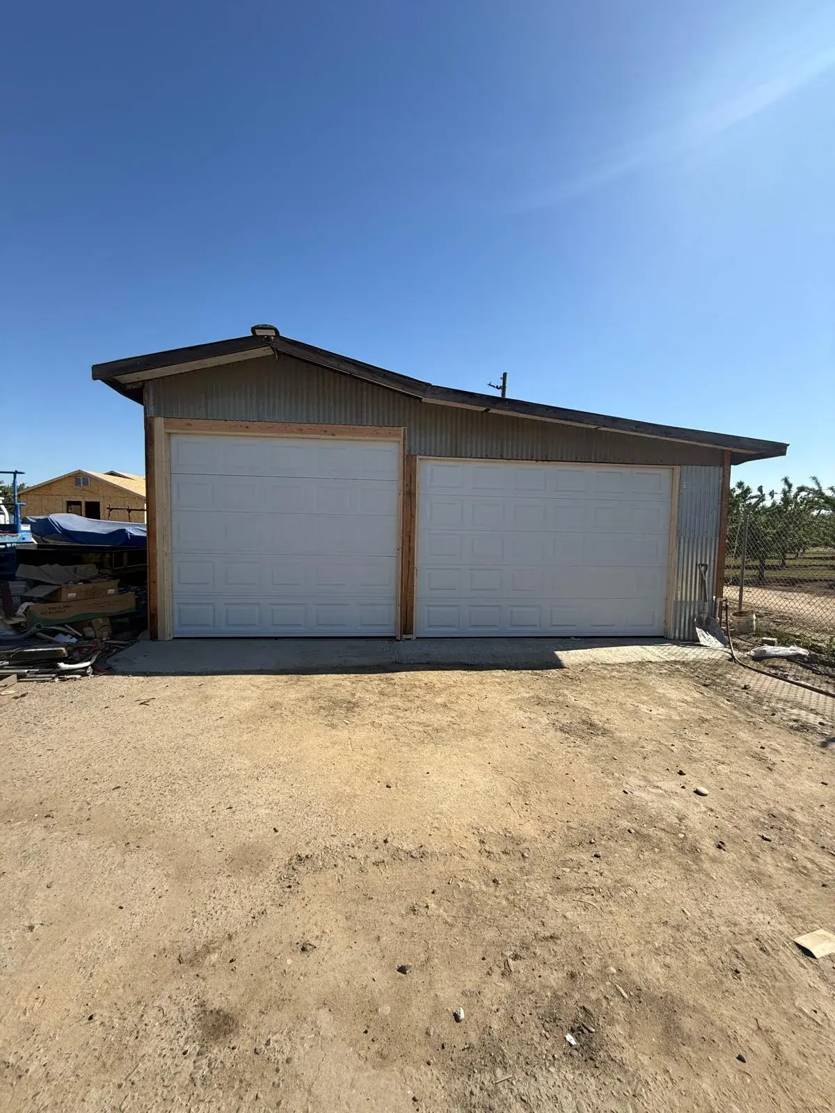 Framing a Garage Opening for Special-Size C.H.I. Model 2250 Doors — Framing preparation, opening verification, door installation, track setup, balance testing. Special-size 9'6" x 8'6" C.H.I. M — apro