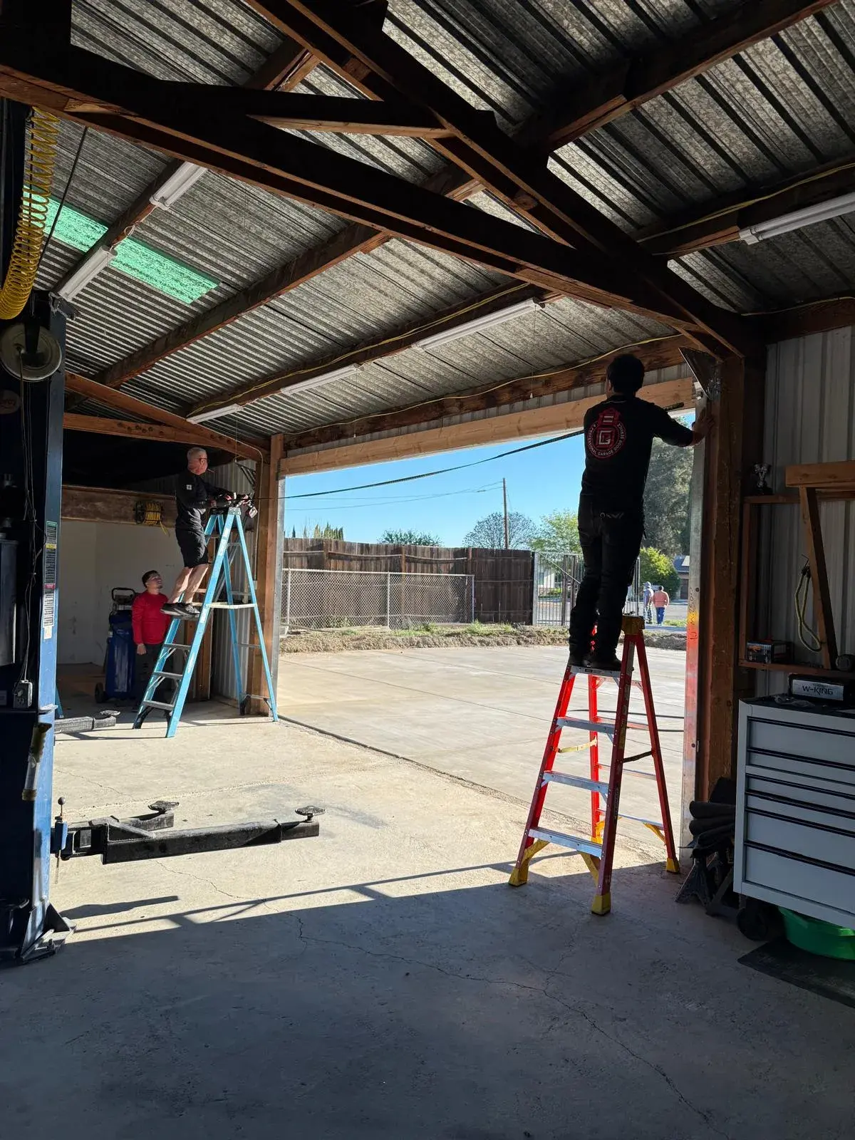 18x9 Janus Model 2500 White Commercial Roll-Up Door Installation — Roll-up barrel and curtain setup, guide alignment, chain or electric readiness, tensioning, final test. Product/job: 18' x 9' — aprof