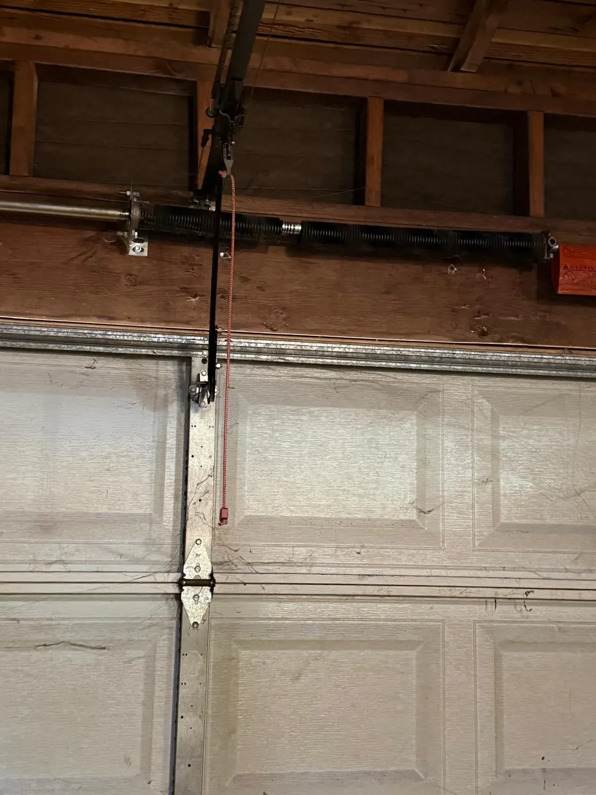 Converting a Two-Car Garage Door from One Spring to a Dual-Spring System — Spring sizing, torsion spring replacement, cable check, balance correction, opener strain reduction. Product: two-car garage