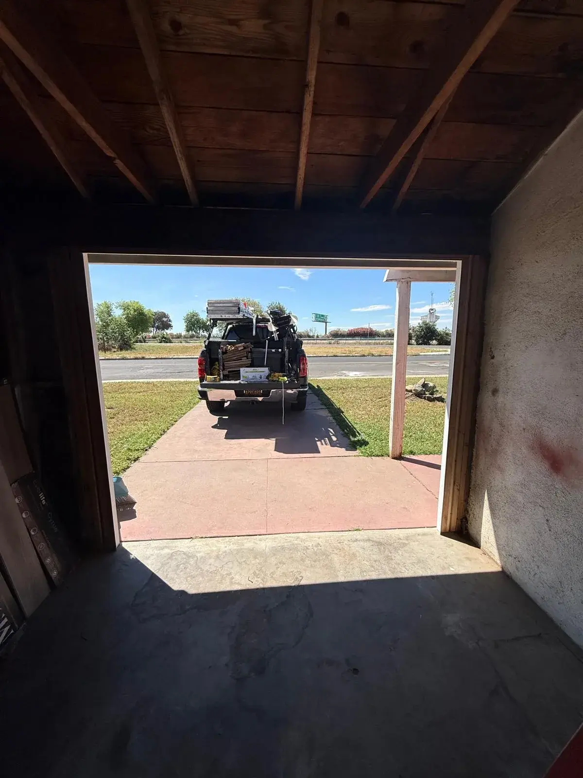 Replacing an Old One-Piece Wood Door with a 9x7 C.H.I. Model 4250 Sectional Door — One-piece wood door removal, sectional conversion, new track and hardware, torsion spring balance. Product/job: 9' x