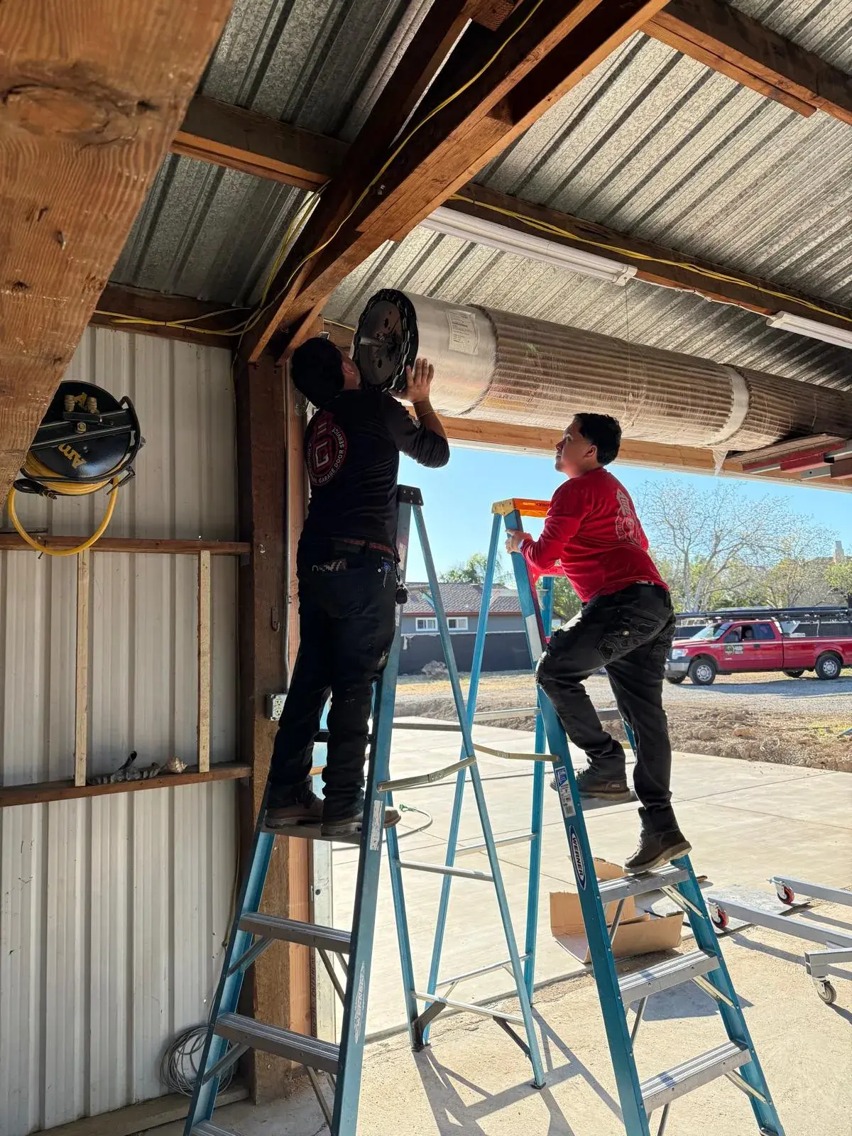 18x9 Janus Model 2500 White Commercial Roll-Up Door Installation — Roll-up barrel and curtain setup, guide alignment, chain or electric readiness, tensioning, final test. Product/job: 18' x 9' — aprof
