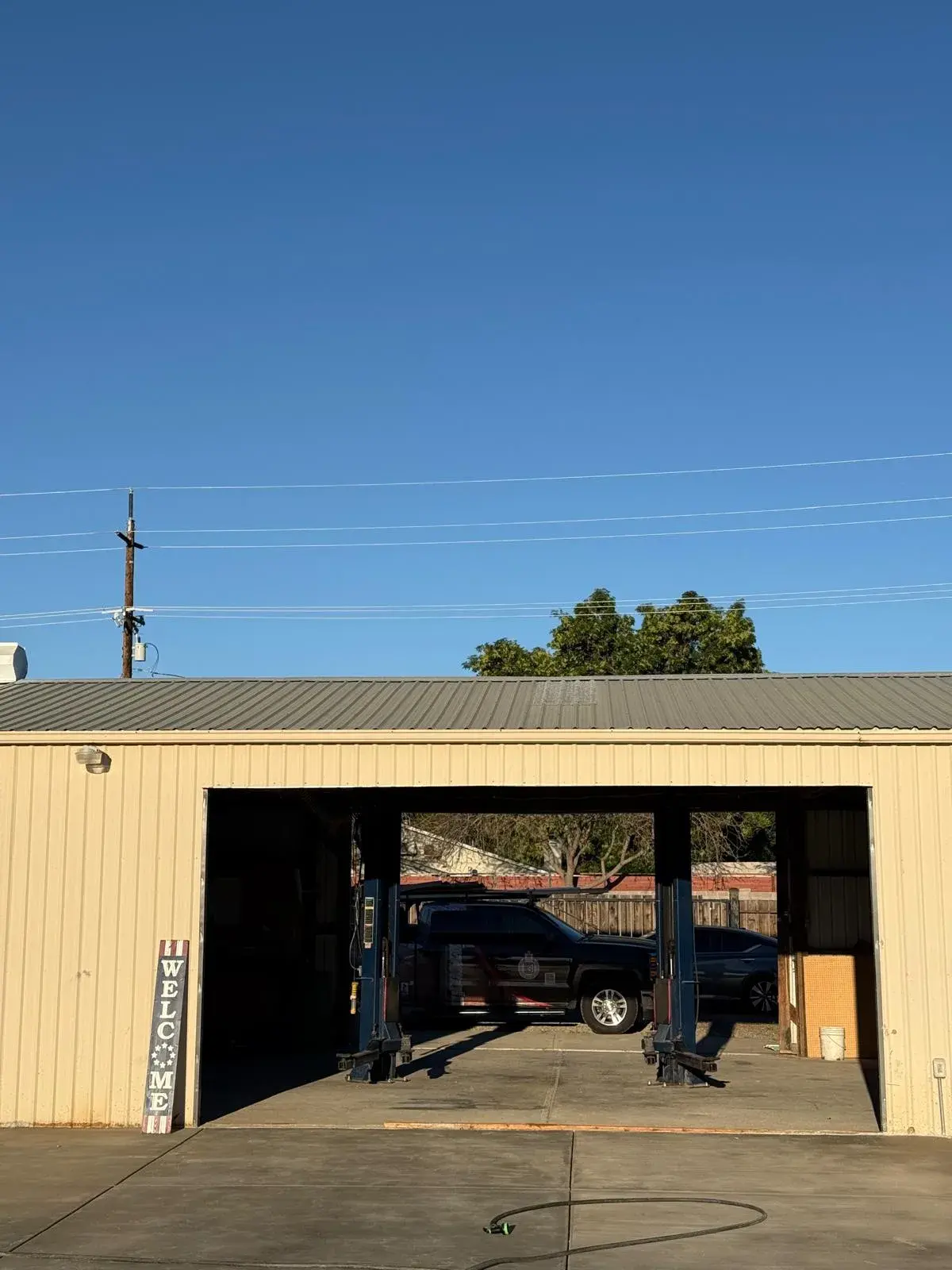 18x9 Janus Model 2500 White Commercial Roll-Up Door Installation — Roll-up barrel and curtain setup, guide alignment, chain or electric readiness, tensioning, final test. Product/job: 18' x 9' — aprof